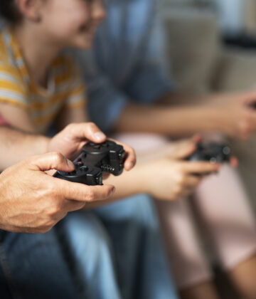 side-view-family-playing-videogame